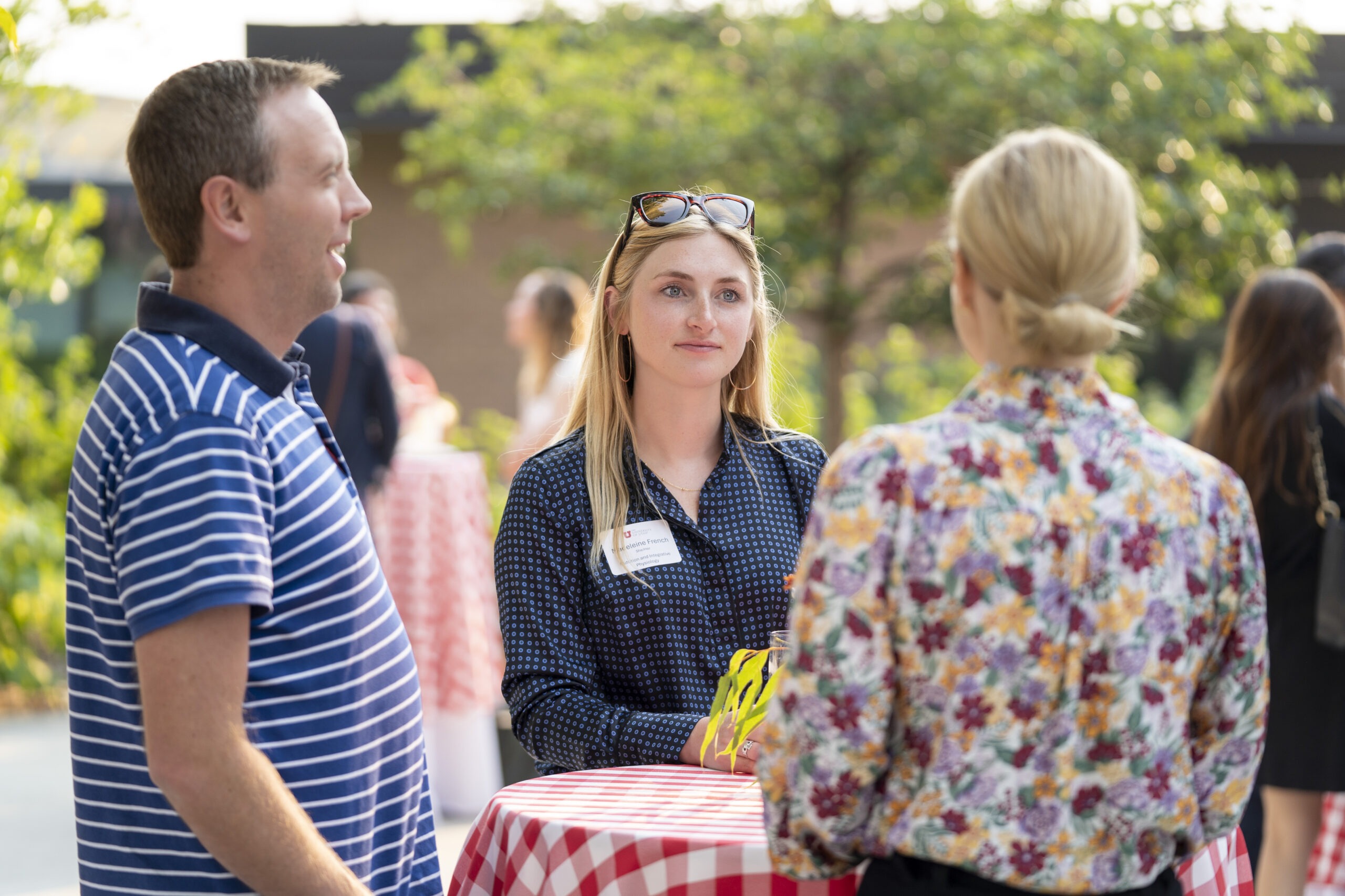 New faculty chatting at Faculty Soiree