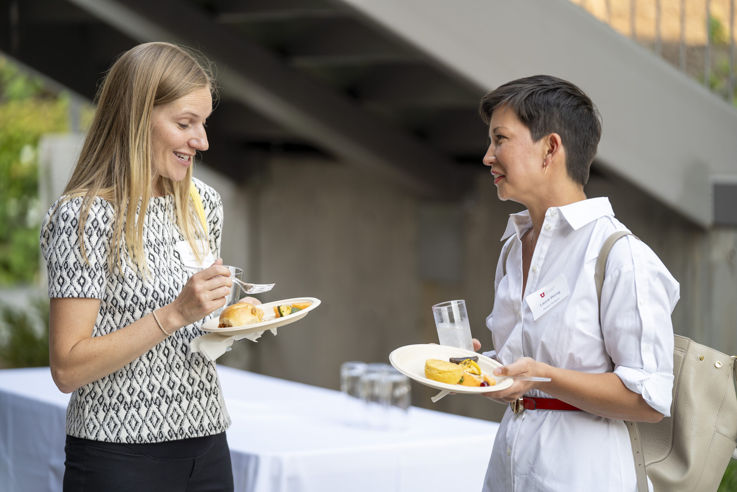 New faculty chatting at Faculty Soiree